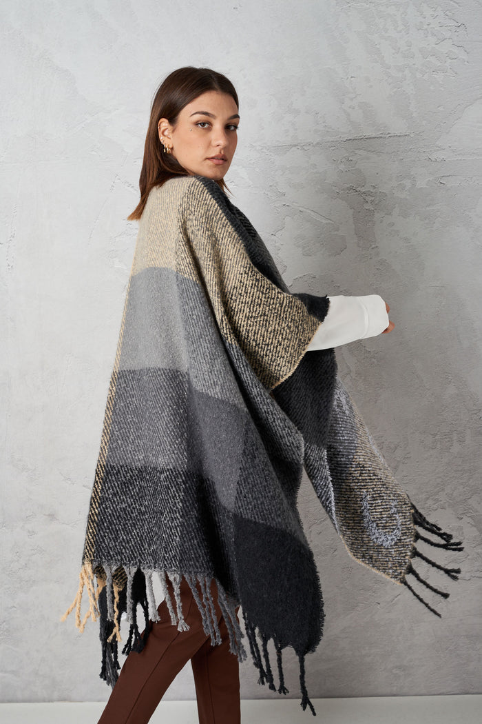 Poncho with logoed fringes